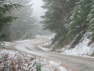 Curvy%20Mountain%20Road%20with%20Snow%20and%20Fog