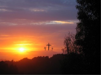 Three Crosses Against Glowing Sunset