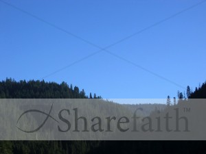Forested%20Mountains%20Against%20Blue%20Sky