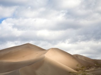 Spotlit Dunes Landscape Photo