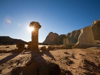 Sun Peeks from Behind Rock