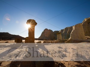Sun Peeks from Behind Rock