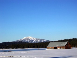 Winter Barn with Mountain Background