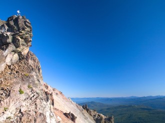 Man Standing at Scenic Viewpoint
