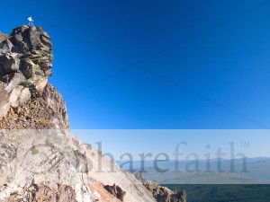 Man Standing at Scenic Viewpoint