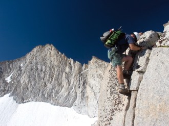 Mountain Climber Scaling Rock