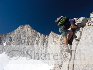 Mountain Climber Scaling Rock