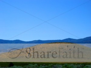 Hill with Blue Sky and Mountains