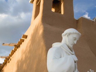 Saint Statue Near Adobe Church